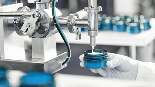 Cosmetic Cream coming out of the machine